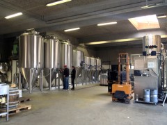 Beer is being poured from the tanks